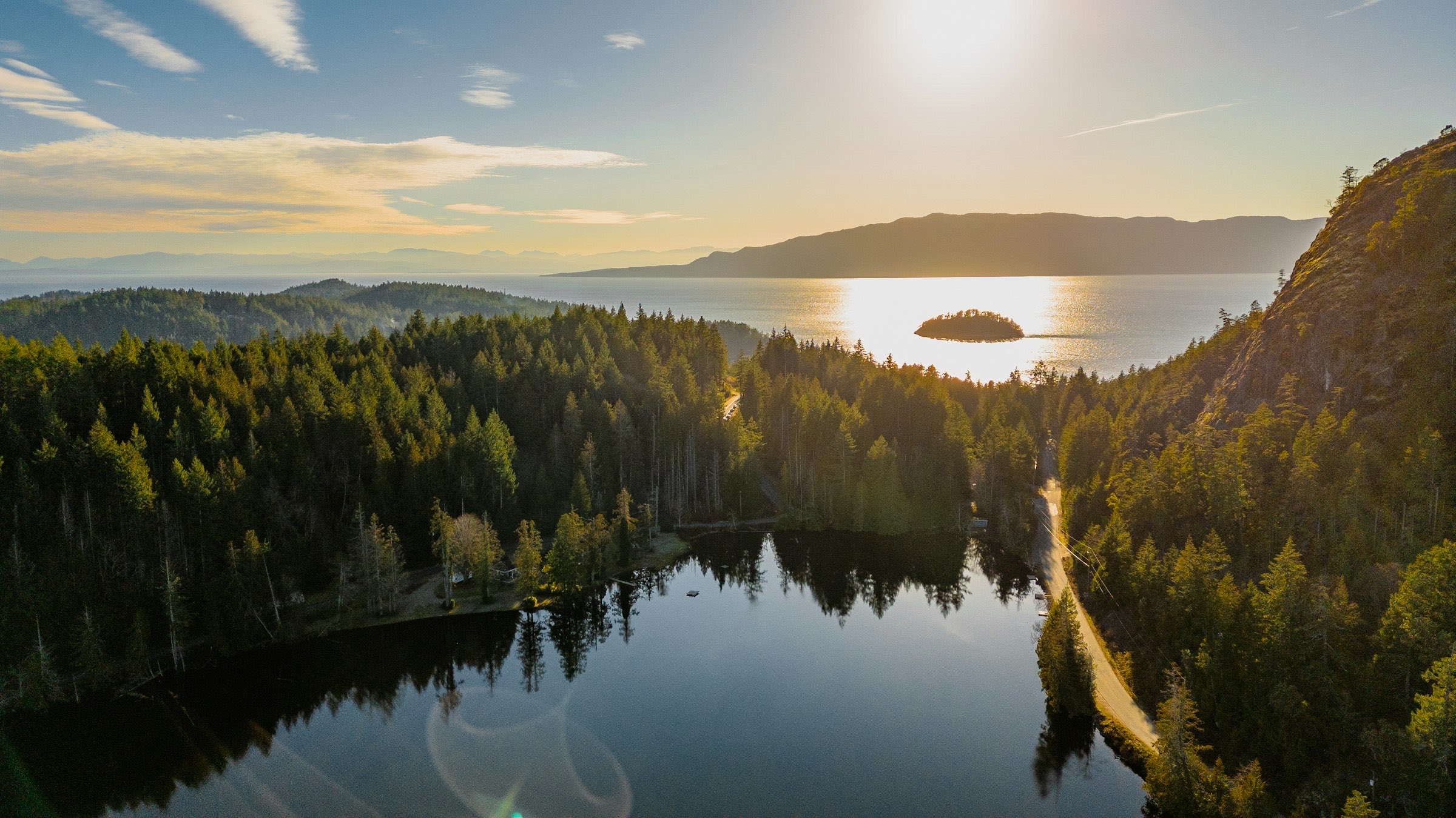 Sunset over Malaspina Strait and the forests of the Sunshine Coast